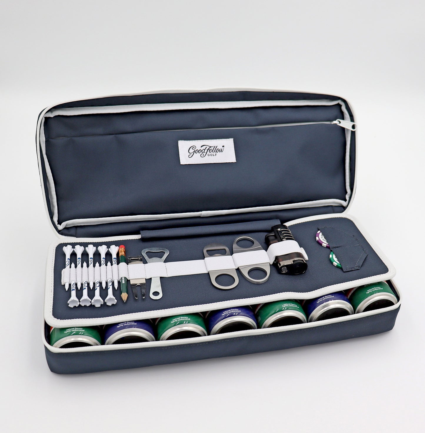Navy Merrymaker golf organizer shown open with golf tees, pencil, ball markers divot tools, energy drinks and more inside