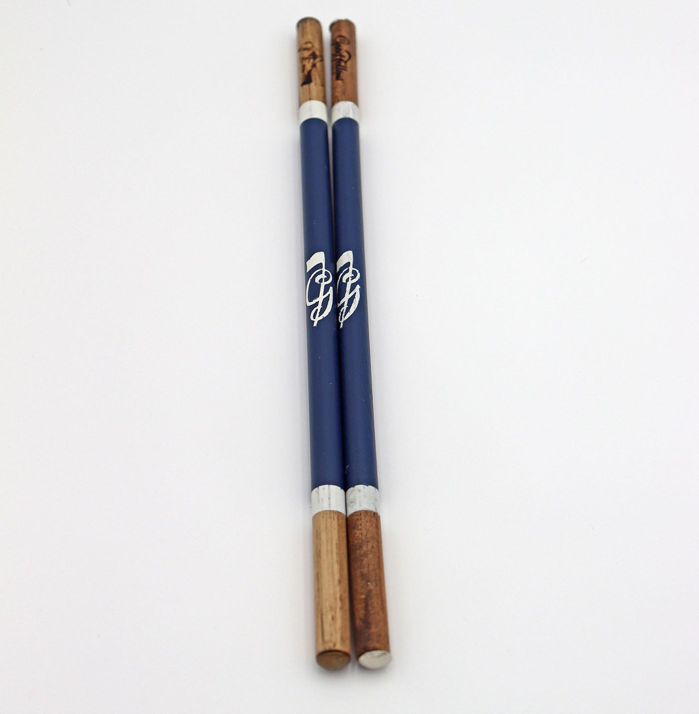 Product image of navy set of handcrafted hickory golf alignment sticks with custom Good Fellow Golf logos.
