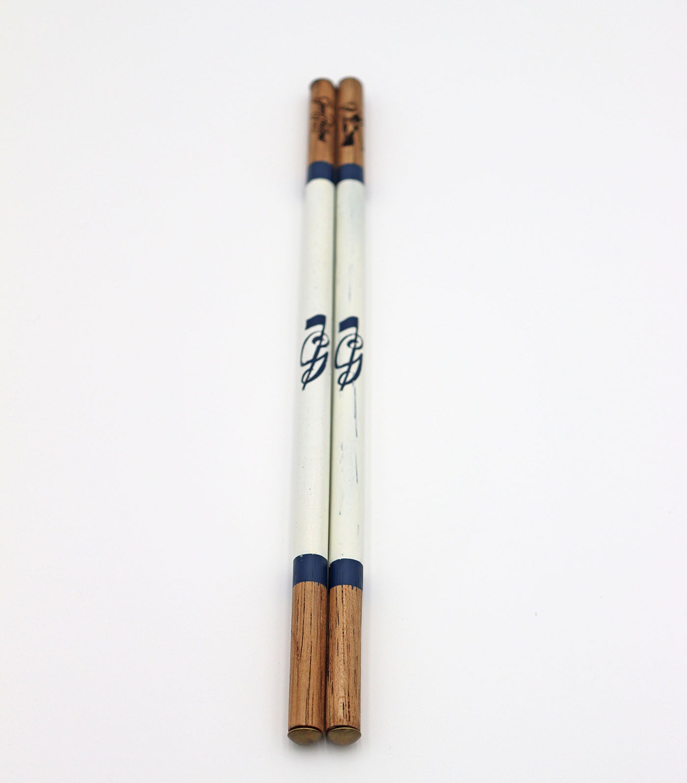 Product image of white set of handcrafted hickory golf alignment sticks with custom Good Fellow Golf logos.