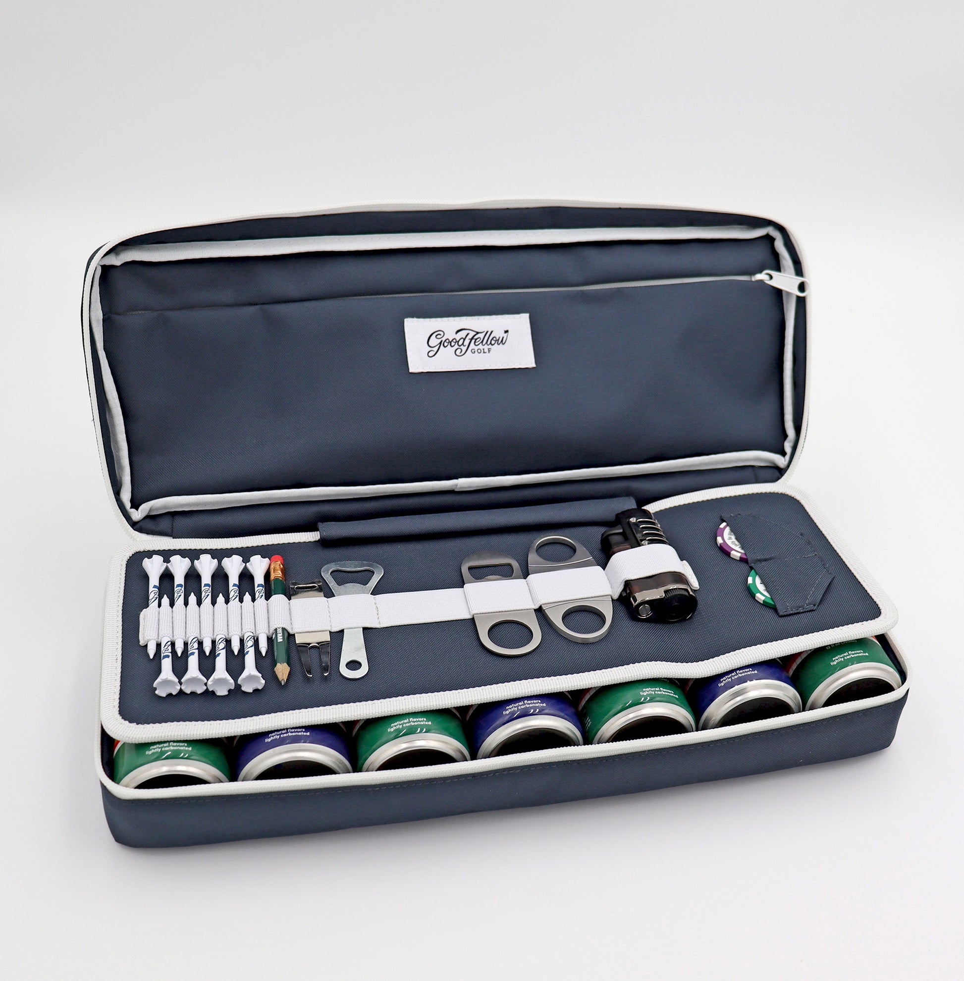 Navy Merrymaker golf organizer shown open with golf tees, pencil, ball markers divot tools, energy drinks and more inside