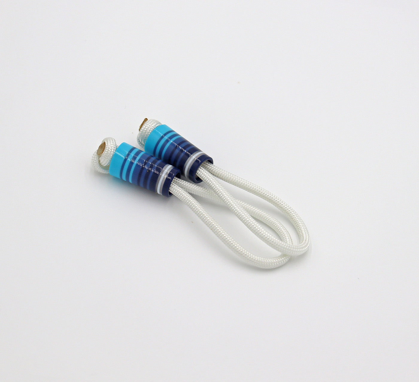 Close up detail image of Good Fellow Golf’s striped ferrules on zipper pull loops.