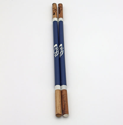 Product image of navy set of handcrafted hickory golf alignment sticks with custom Good Fellow Golf logos.