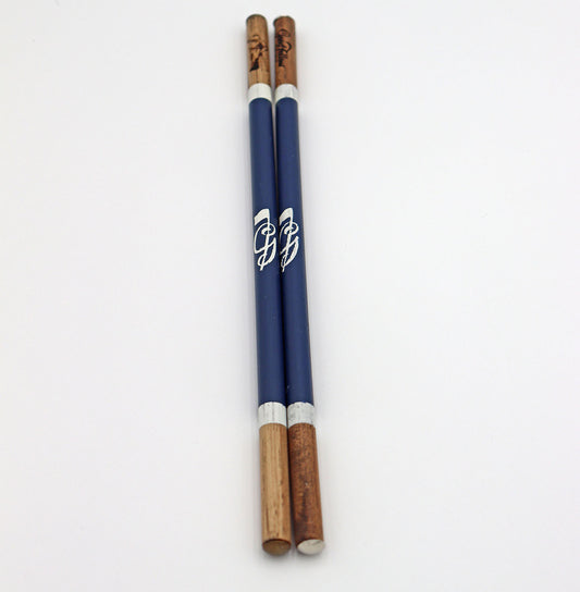 Product image of navy set of handcrafted hickory golf alignment sticks with custom Good Fellow Golf logos.